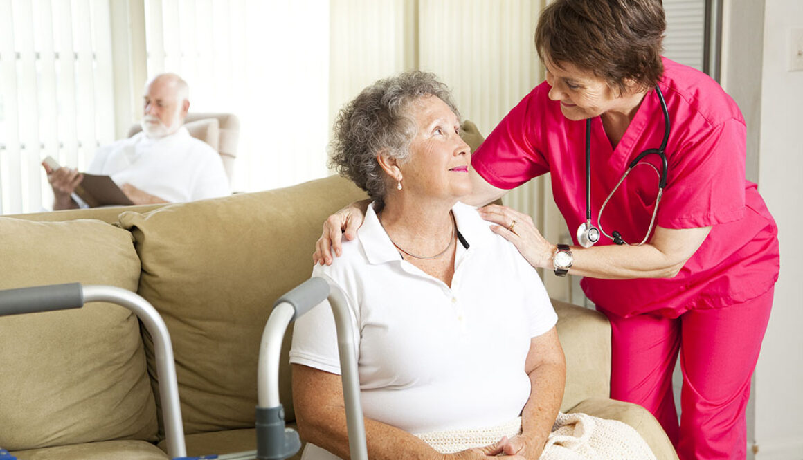 A Senior Woman Sitting On The Couch Being Comforted By A Hospice Caregiver Hospice Care For Dementia